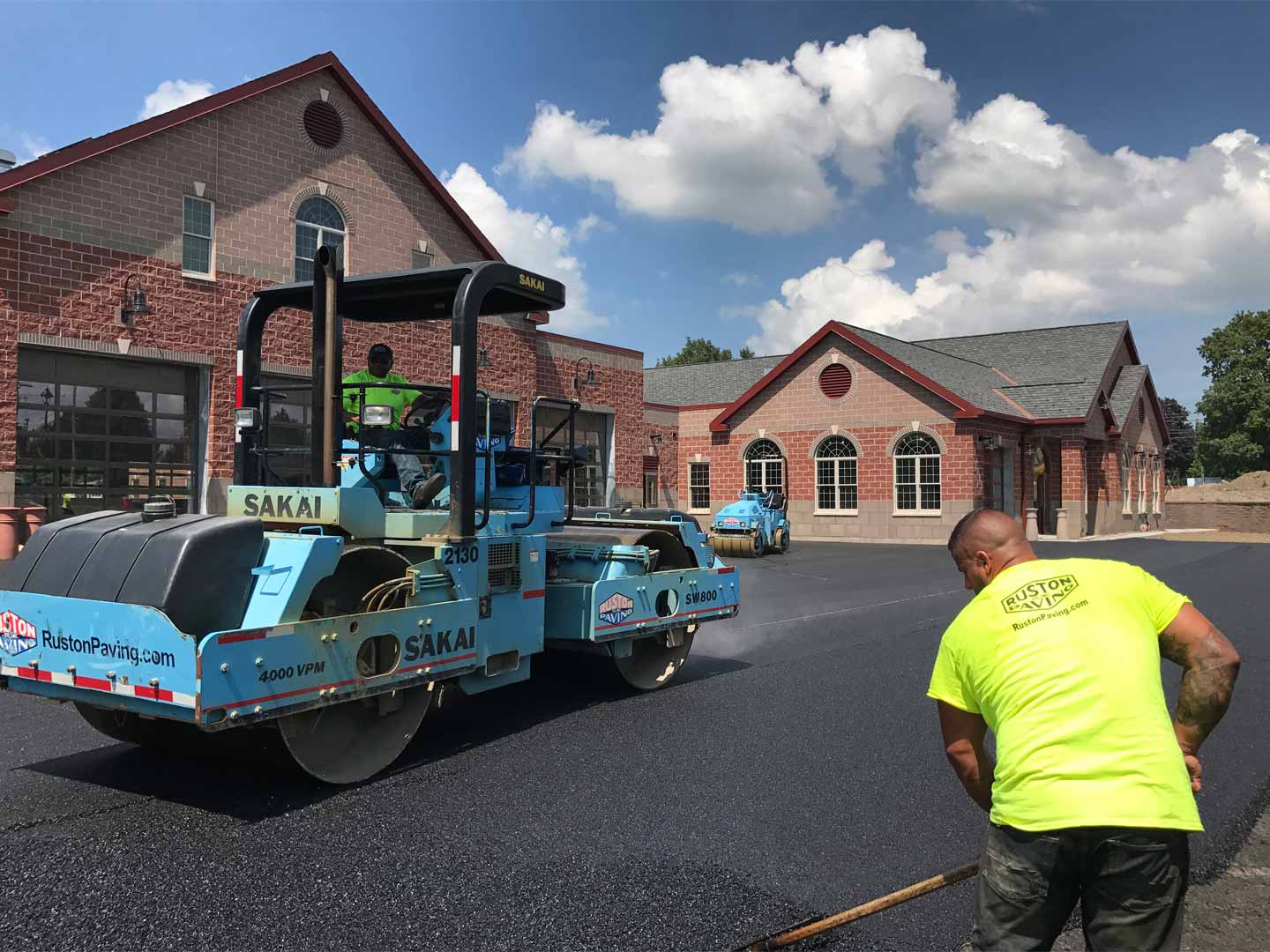 Fire Station Paving Project with roller and laborer
