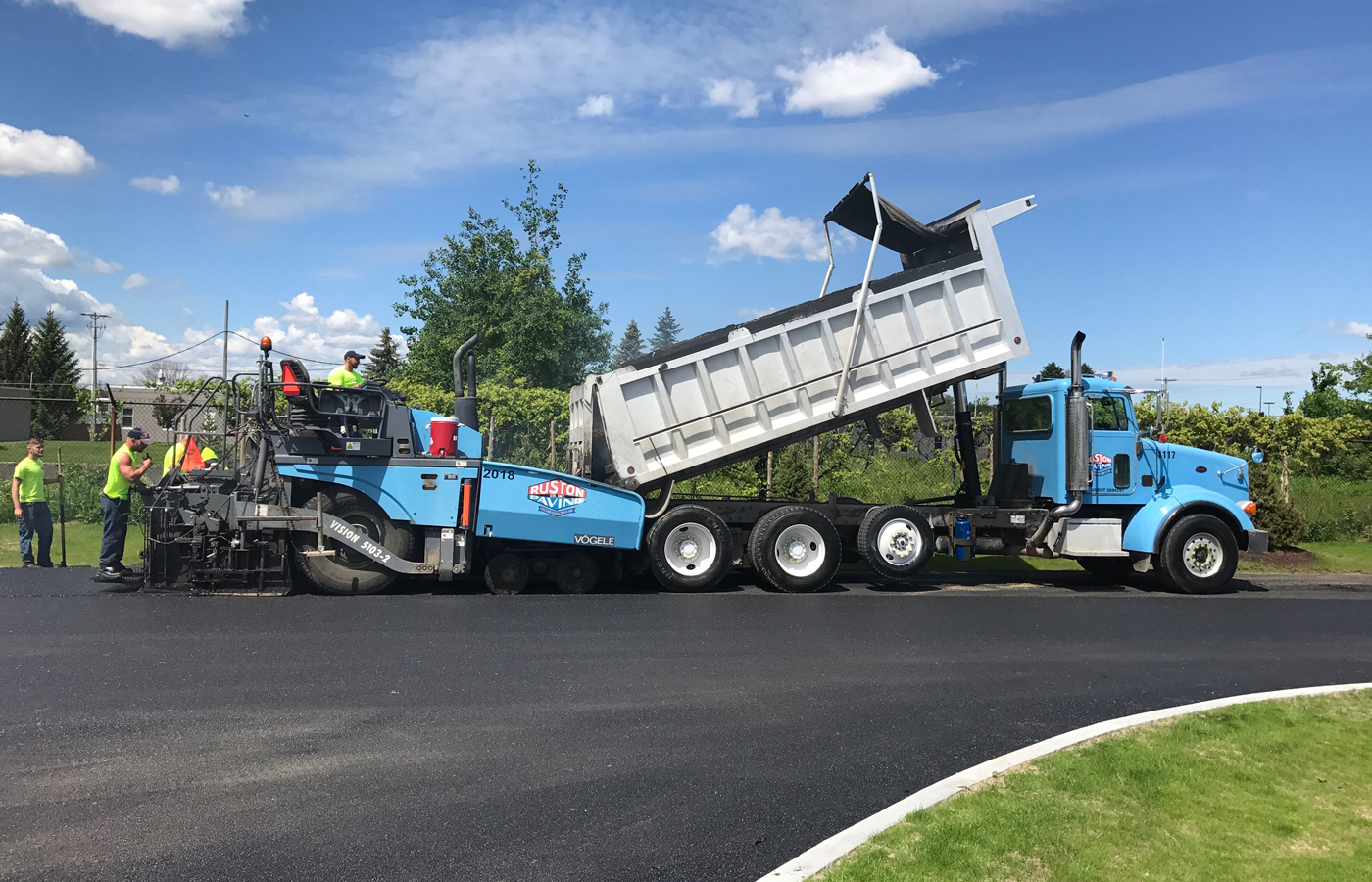 Ruston Paving dump truck and paver installs asphalt