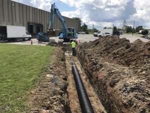 Ruston Paving installing storm water drainage pipe at Thruway Fasteners in Liverpool