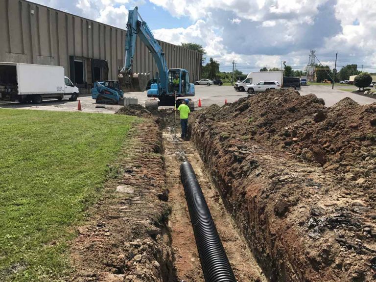 Ruston Paving installing storm water drainage pipe at Thruway Fasteners in Liverpool