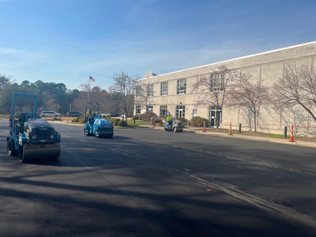 Rolling new asphalt at YMCA in Cary