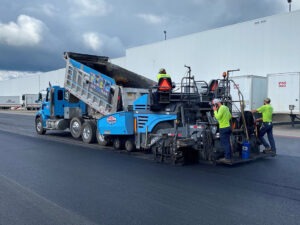 Paving surface course at McLane Company in Baldwinsville, NY