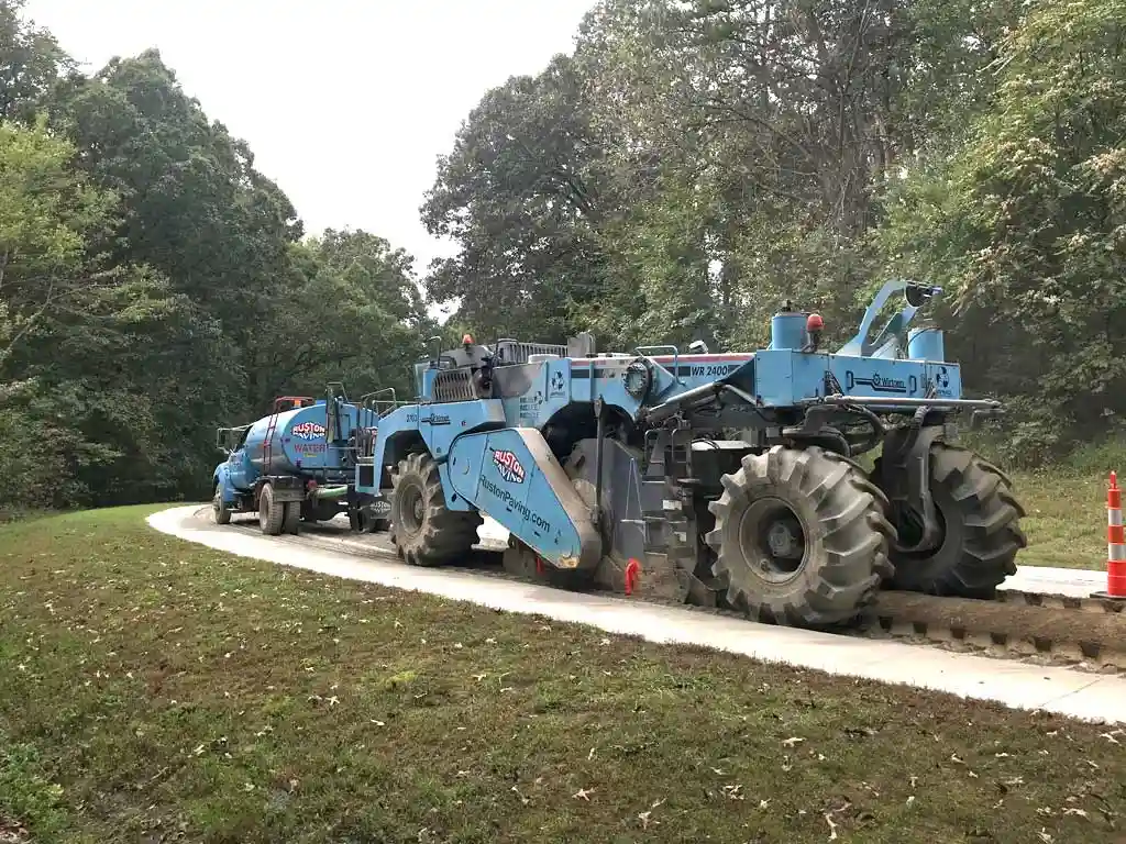 Full-depth reclamation pavement base reconstruction using specialized equipment to process and stabilize the existing roadway