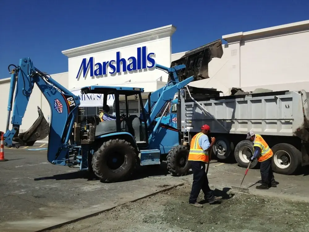 Commercial parking lot replacement full-depth removal with asphalt and base material being removed