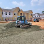 Spreading stone at th Winston Salem Choice Neighborhood Improvements project