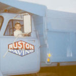 Mark Ruston future president of Ruston Paving in dump truck