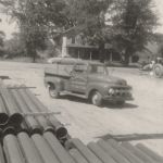 Ruston Paving vintage Ford pickup truck and tractor grader in Syracuse