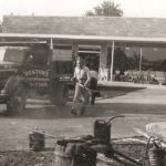 Ruston Paving installing asphalt with laborers and vintage dump truck at Westinghouse Appliances in Syracuse