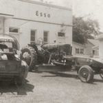 Ruston Paving vintage Ford pickup truck and tractor grader at Esso in Syracuse