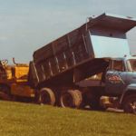 Ruston Paving installing asphalt with International dump truck and blaw knox paver