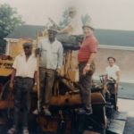 Mike Ruston and paving crew on Blaw Knox asphalt paver