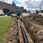 Ruston Paving installing storm water drainage pipe at Thruway Fasteners in Liverpool