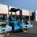Ruston Paving compacting asphalt pavement at Dorschel Toyota in Rochester, NY