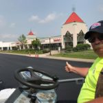 Ruston Paving roller operator gives a thumbs up to our paving job at Waterloo Outlets in Waterloo, NY
